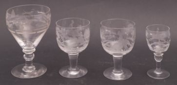 A group of four 19th century hunting theme drinking glasses, comprising a rummer,