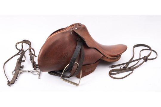 An English tan leather riding saddle, with nickel stirrups and snaffle, with tack. - Image 2 of 4