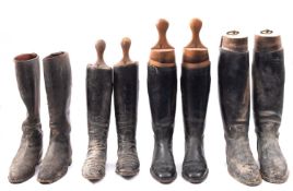 Four pairs of black leather riding boots, three with trees,