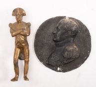 A gilt brass figure of Napoleon,14cm high, together with a circular bas relief bust of Napoleon,