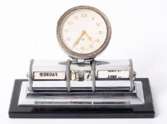 An early 20th century nickel plated perpetual desk calendar having eight day clock over cylindrical