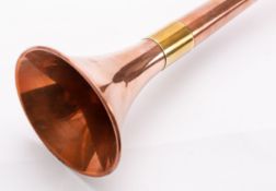 A copper and brass bound coaching horn with trumpet horn,