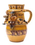 Harry Juniper [Contemporary] a terracotta puzzle jug the shoulders modelled with three musicians