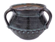 Attributed to Abuja, a stoneware jar and cover with three lug handles