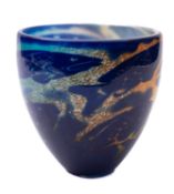 A Dartington cased art glass bowl the exterior decorated with blue fish over white,