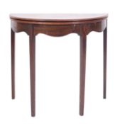 A George III mahogany half round tea table,