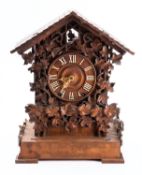 A Victorian Black Forest cuckoo clock the eight-day duration movement striking on a gong,