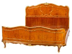 A burr walnut and parcel gilt double bed in Louis XV transitional style,