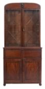 A Regency mahogany, ebonised and brass inlaid secretaire bookcase,