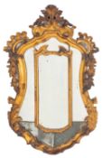 An Italian carved and giltwood framed marginal wall mirror, late 18th century; of cartouche form,
