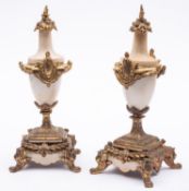 A pair of Continental alabaster and gilt metal mounted side urns,