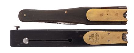 An Antique ebony and brass ink dip pen quill cutter, maker 'Rodgers, Cutlers to Her Majesty,