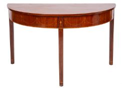 The D-end section of a George III mahogany and inlaid dining table forming a side or pier table,