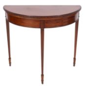 A mahogany demi-lune folding card table, in George III style,