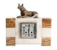 An Art Deco Mantel clock the eight-day duration movement striking on a bell with an outside