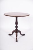 A George III mahogany circular tea table,