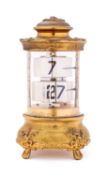 Ansonia, The Plato Clock an American flip clock in a cylindrical case with glazed sides,