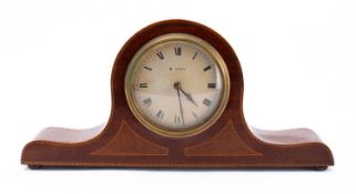 An Edwardian mahogany mantel clock having an eight-day duration timepiece movement,