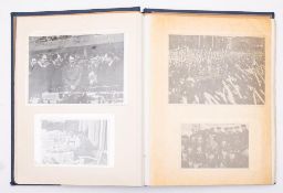 An Album of WWII German picture cards of Adolf Hitler by B H W Hadank, in an associated stamp album.