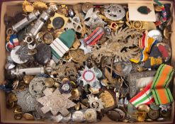 A collection of various Regimental cap badges, buttons and lapel badges etc.