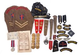 A collection of militaria, including a WWI period open face pocket watch, a WWII 1939-45 War Medal,