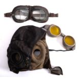 A WWII RAF' C' type leather flying helmet together with a pair of yellow tinted goggles and a pair