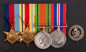 A WWI silver wound badge number 'RAF 9215' together with four WWII service medals