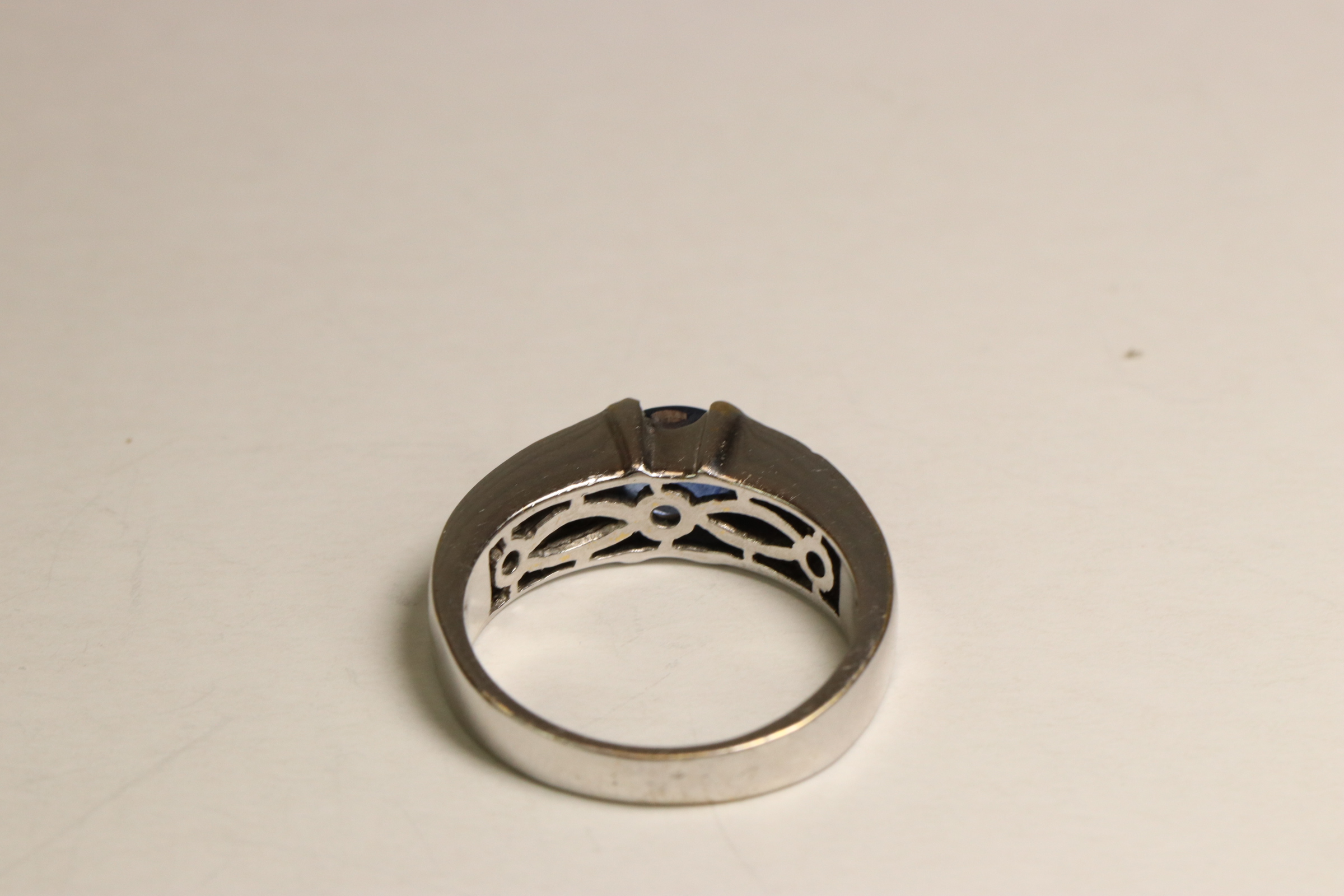 A Sapphire and Diamond Dress Ring, Circa 1990 A Sapphire and Diamond Dress Ring, Circa 1990 The oval - Image 3 of 5