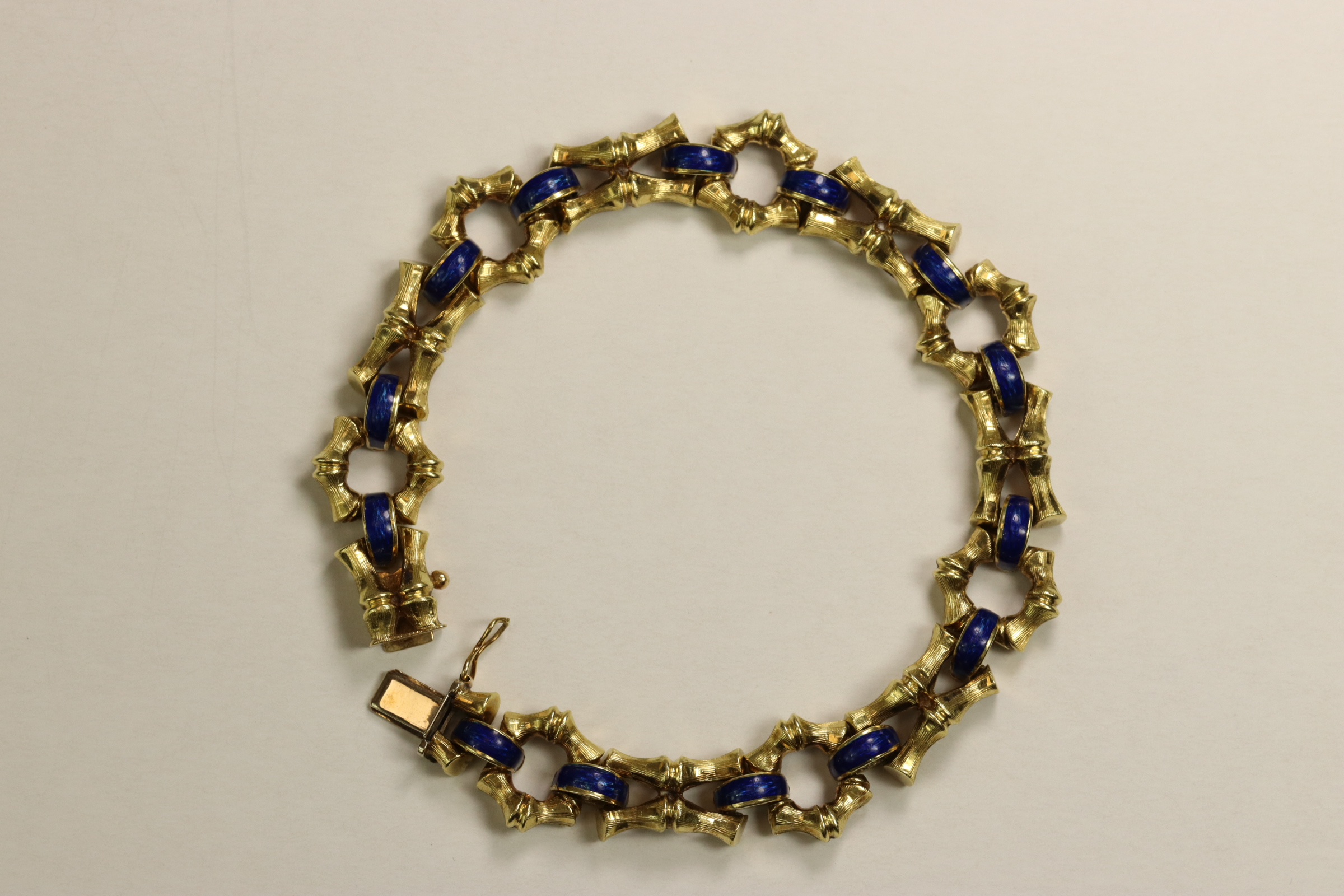 A 1970s 18 Carat Yellow Gold and Enamel Bracelet,Of bamboo design with royal blue enamelled - Image 2 of 11