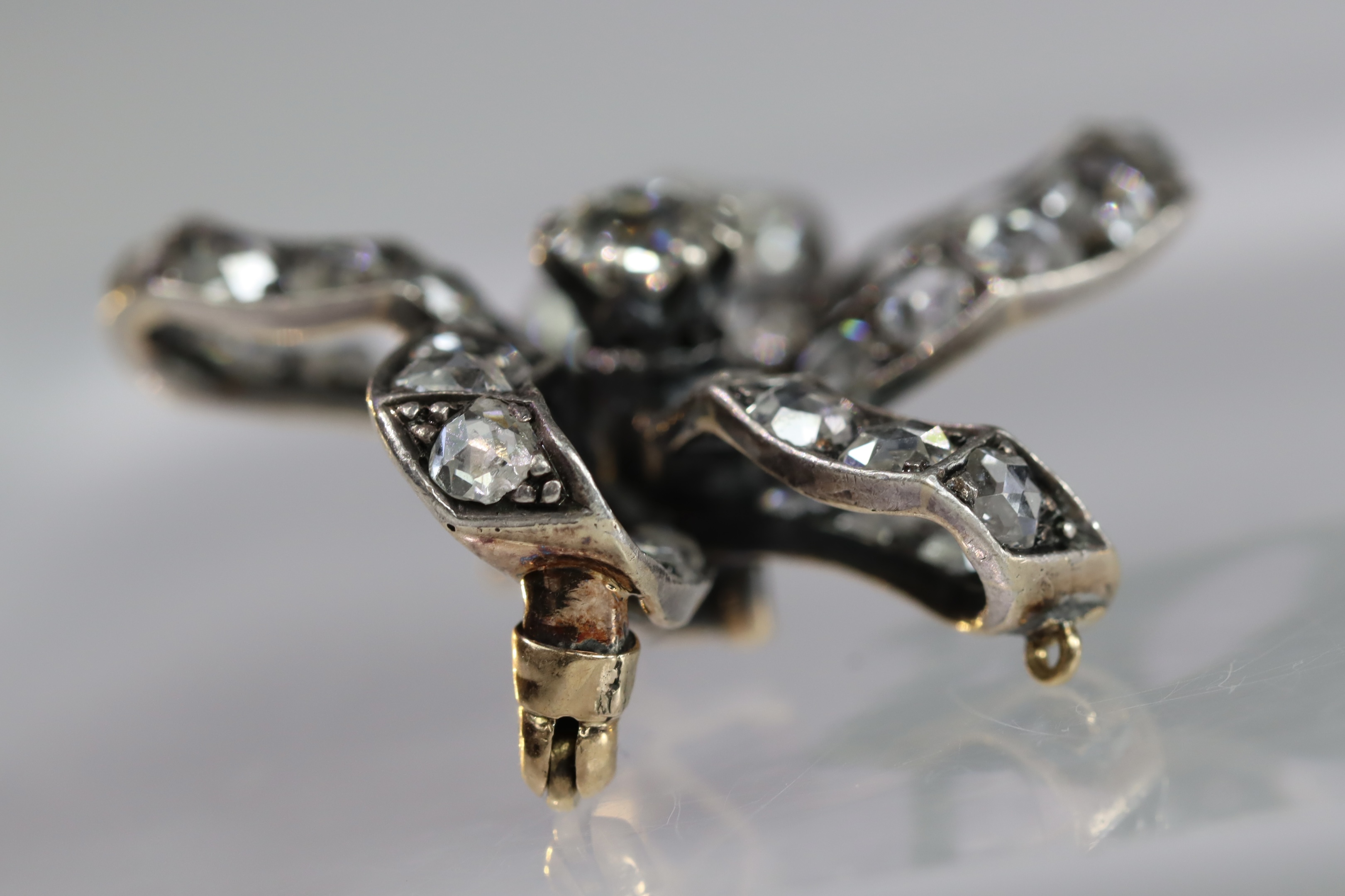 An Antique Diamond and a rose-cut Diamond Stylised Bow Brooch, circa 1890, centrally set with a - Image 7 of 13