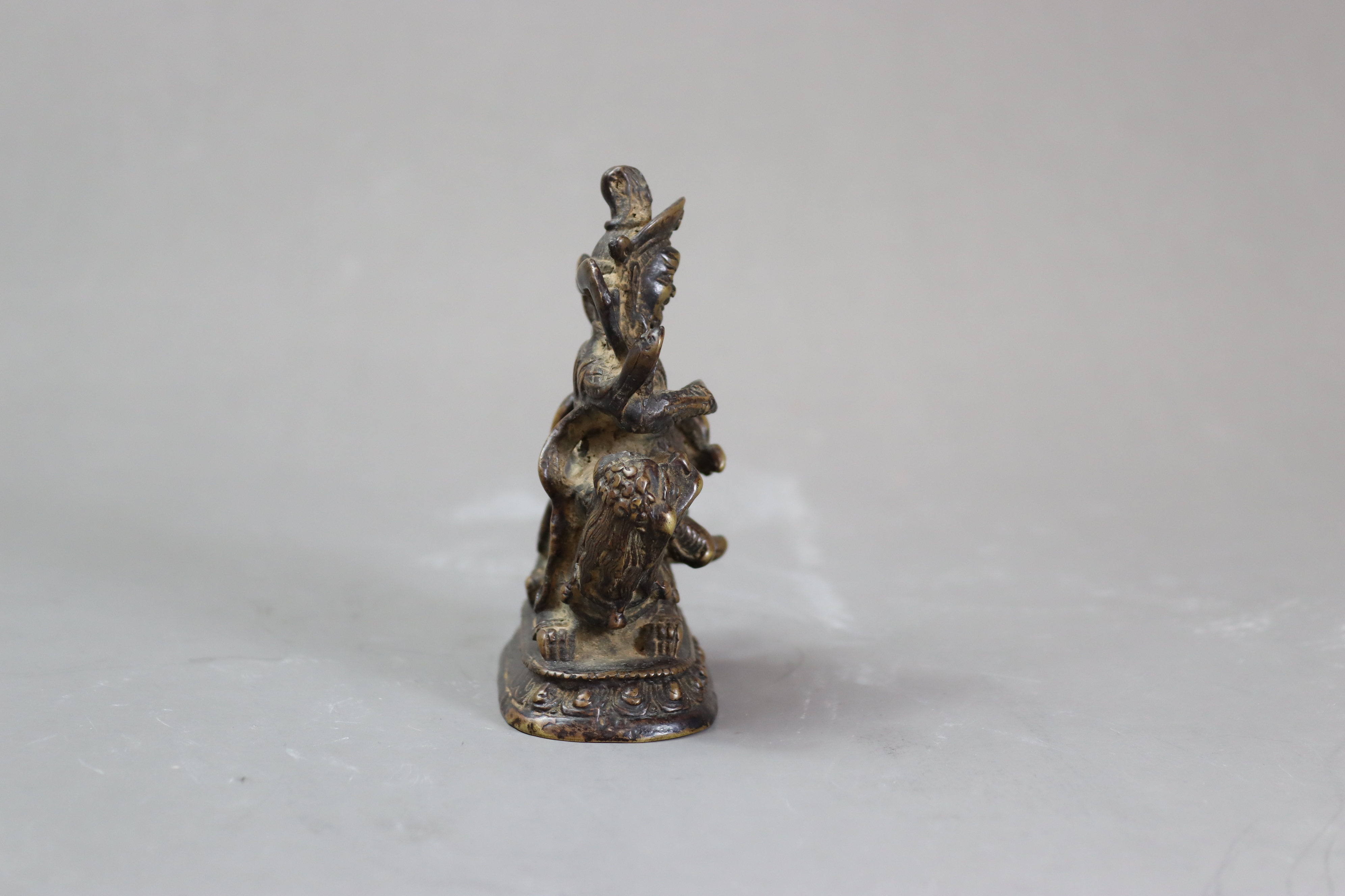 A Bronze God of Fortune, 19/20th centurythe fierce bearded deity clutching his mongoose, with dark - Image 3 of 8