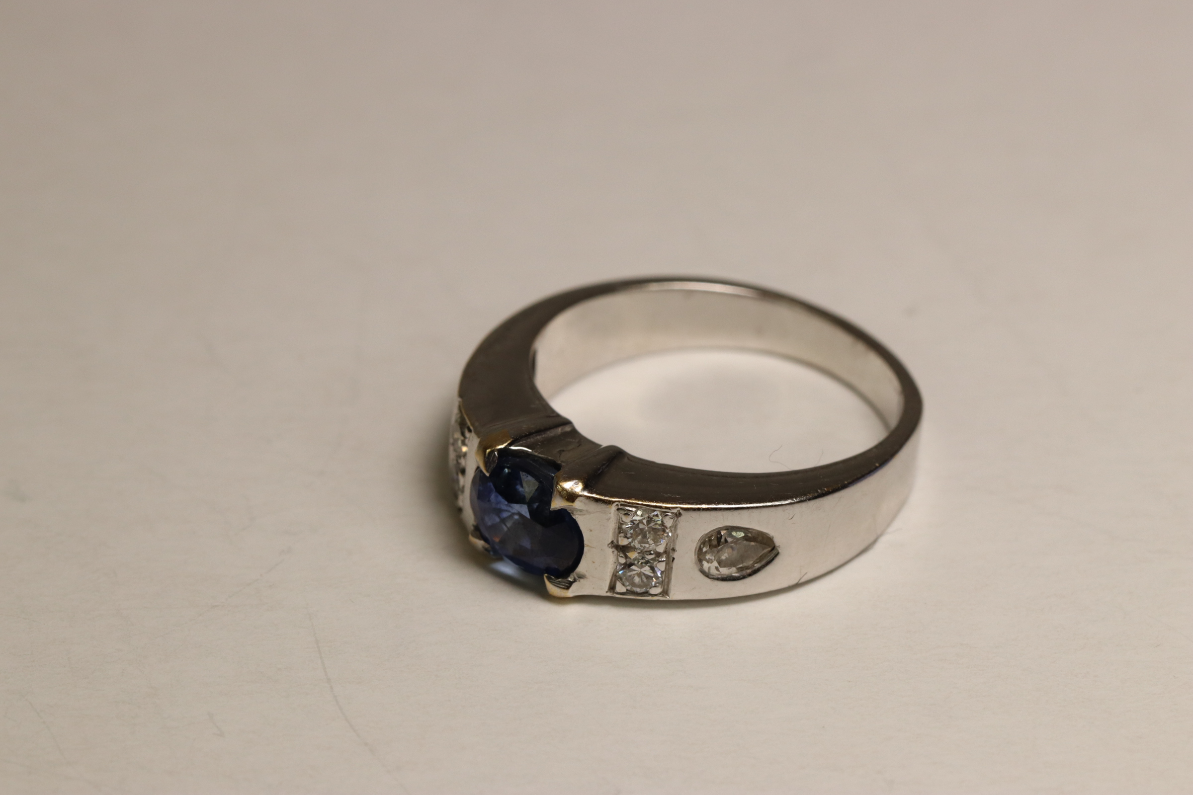 A Sapphire and Diamond Dress Ring, Circa 1990 A Sapphire and Diamond Dress Ring, Circa 1990 The oval - Image 4 of 5