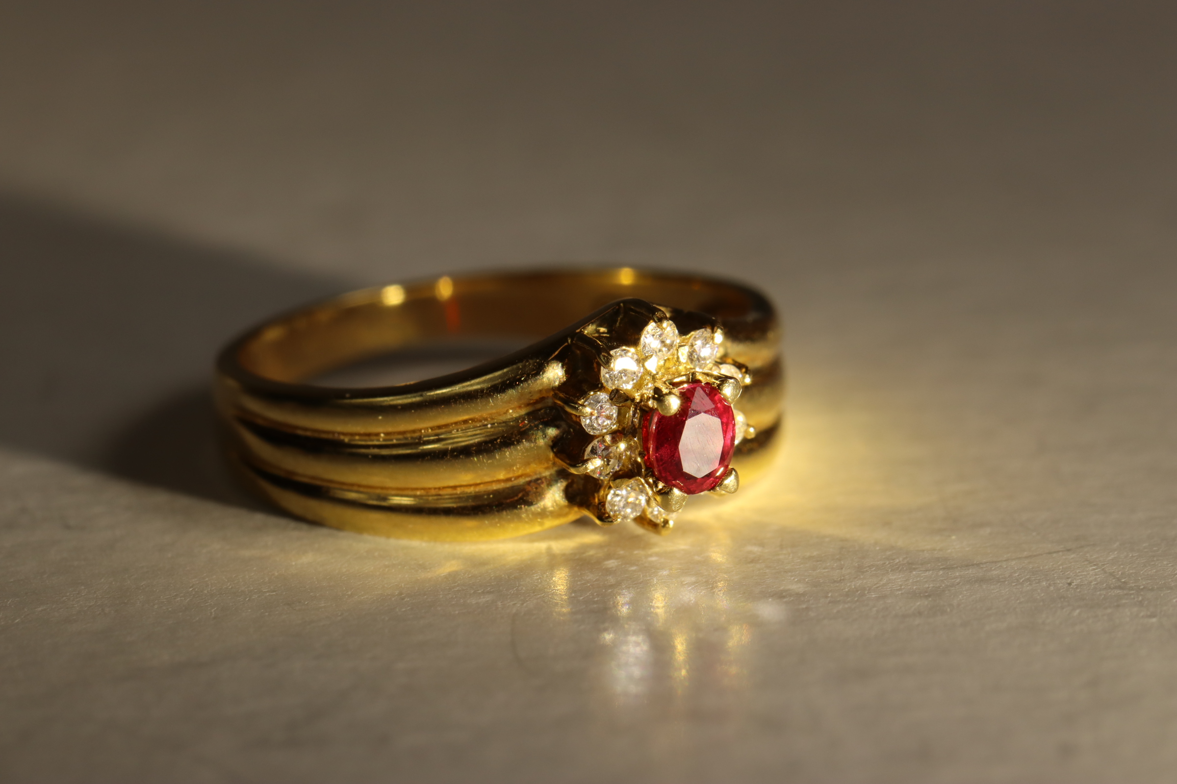 A Small Ruby and Diamond Cluster Ring,  Mounted in 18 ct yellow gold 3.07g, size M-N