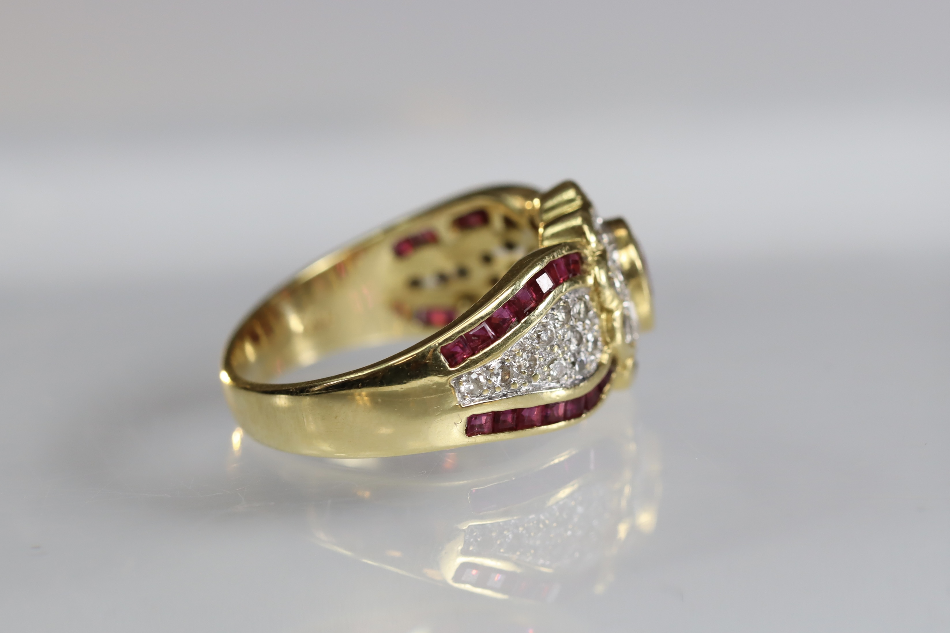 A contemporary 18 carat Yellow Gold, Ruby and Diamond Dress Ring,the oval shaped ruby central - Image 7 of 14