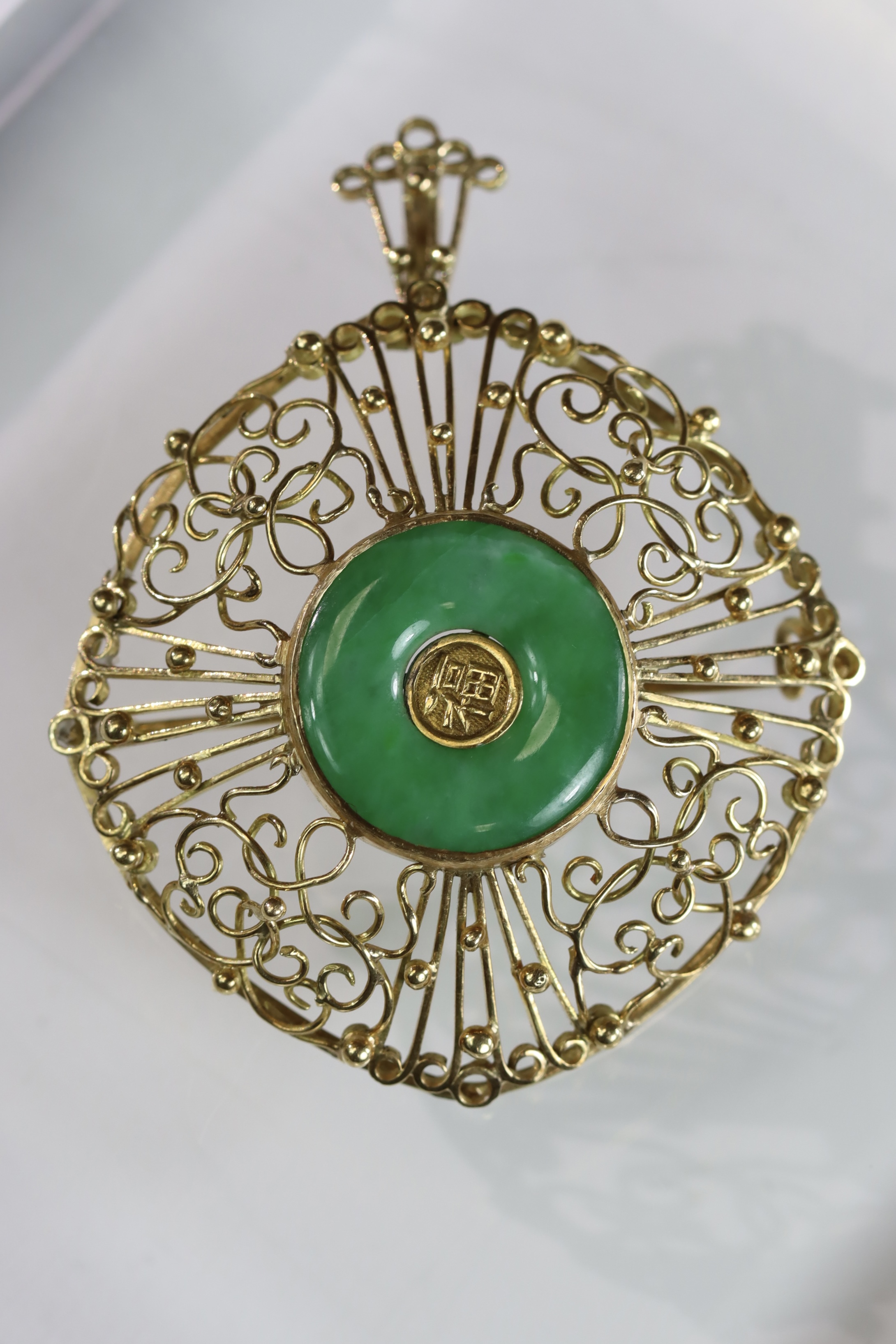 A 1960s Apple Green Jadeite Bi Disc and 18 ct Yellow Gold Pendant/Brooch, in entwined wirework - Image 6 of 14