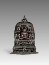 A Bronze Jain shrine with Rubies and Silver Inlay. India 15th century.A beautifulÂ Jain bronze