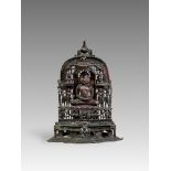 A Bronze Jain shrine with Rubies and Silver Inlay. India 15th century.A beautifulÂ Jain bronze