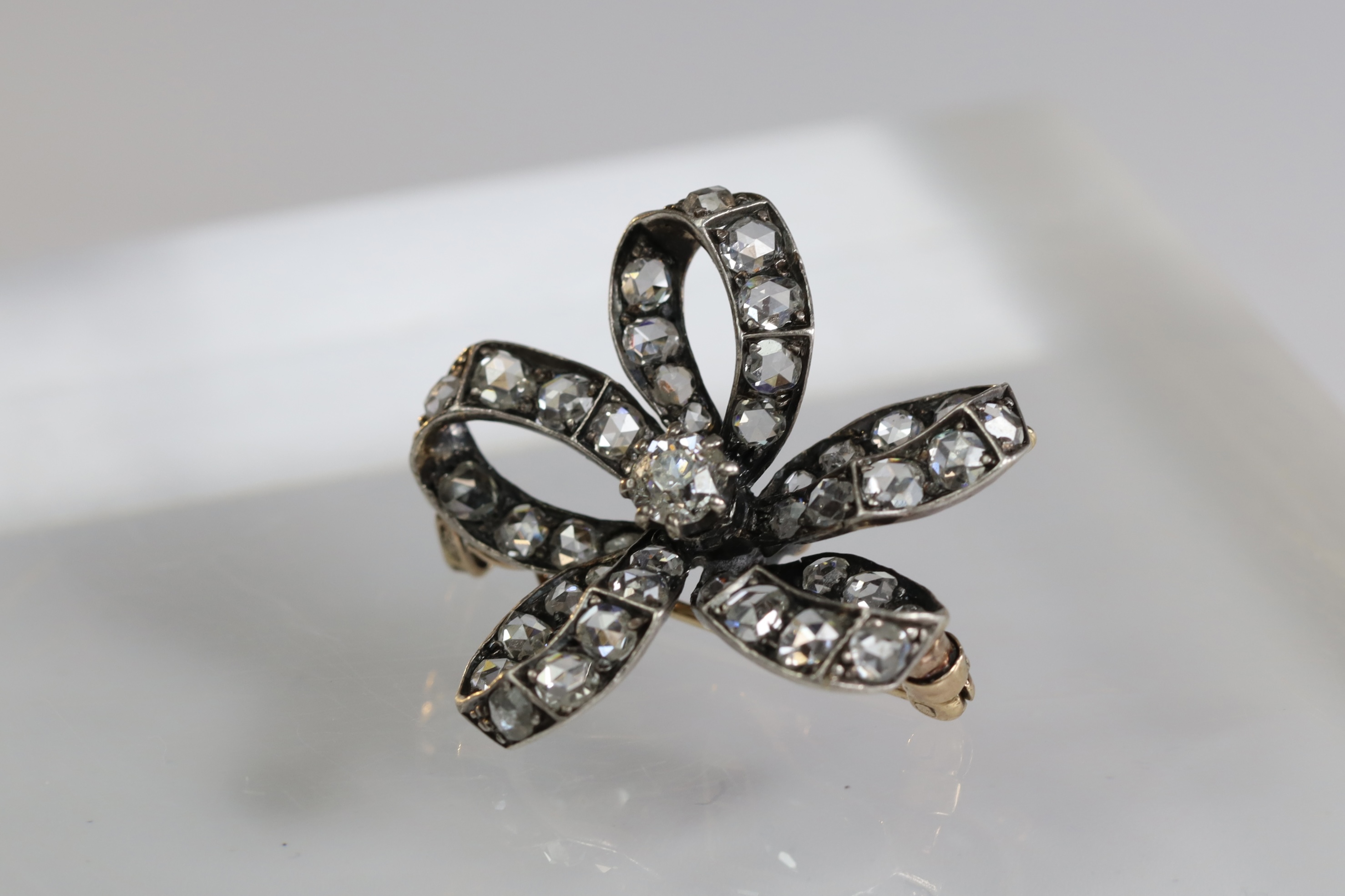 An Antique Diamond and a rose-cut Diamond Stylised Bow Brooch, circa 1890, centrally set with a - Image 3 of 13