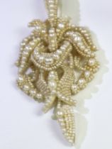 An Antique Natural Pearl and Seed Pearl Pendant,circa 1870, of flower head and scroll design, L: