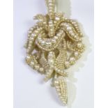 An Antique Natural Pearl and Seed Pearl Pendant,circa 1870, of flower head and scroll design, L: