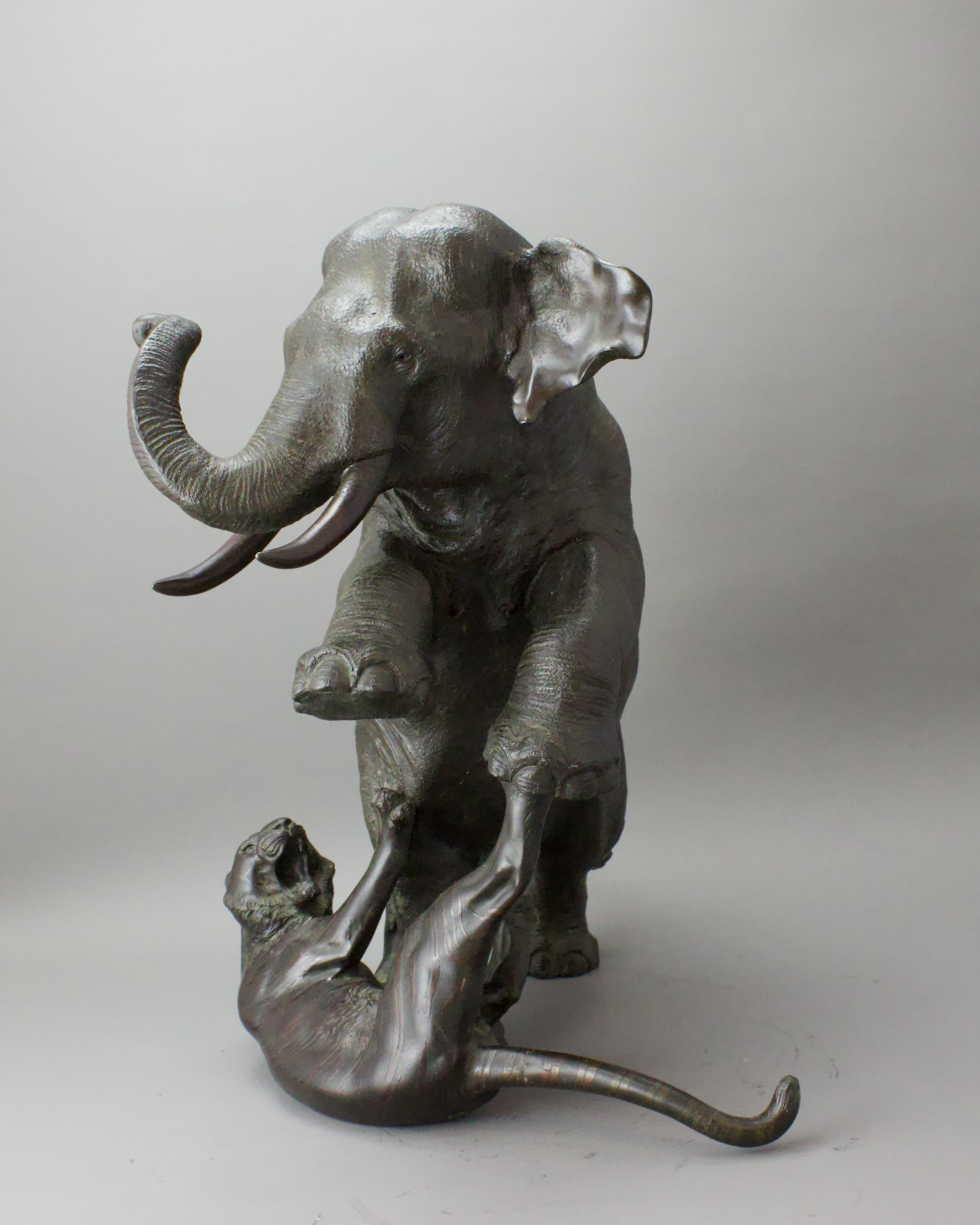 A Japanese Bronze Elephant and Tigers Group, Meiji period,with one seal, the enraged elephant in - Image 9 of 14