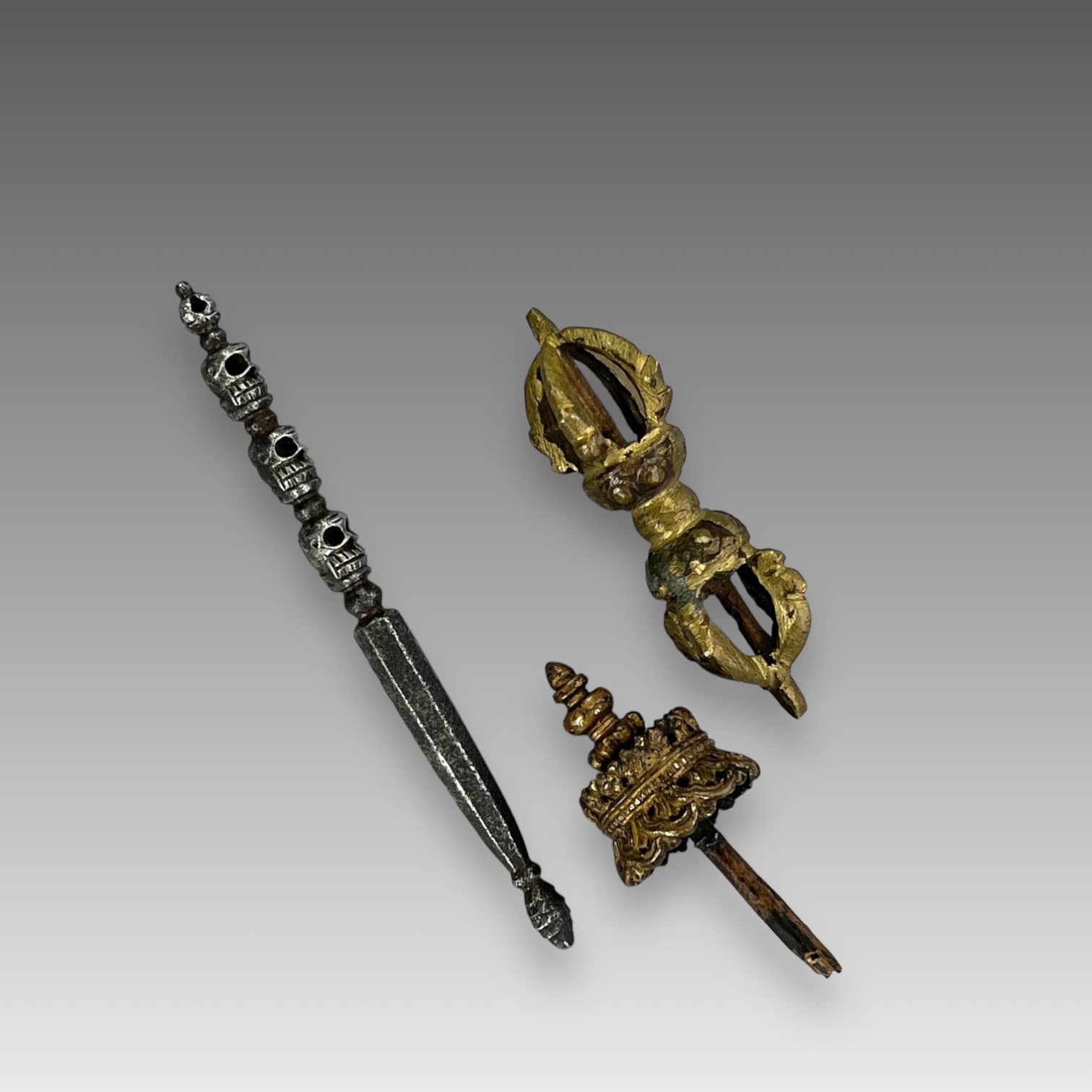 A Bronze Double Vajra, a Canopy, and a white metal Sceptre with skulls,19th centuryA Bronze Double