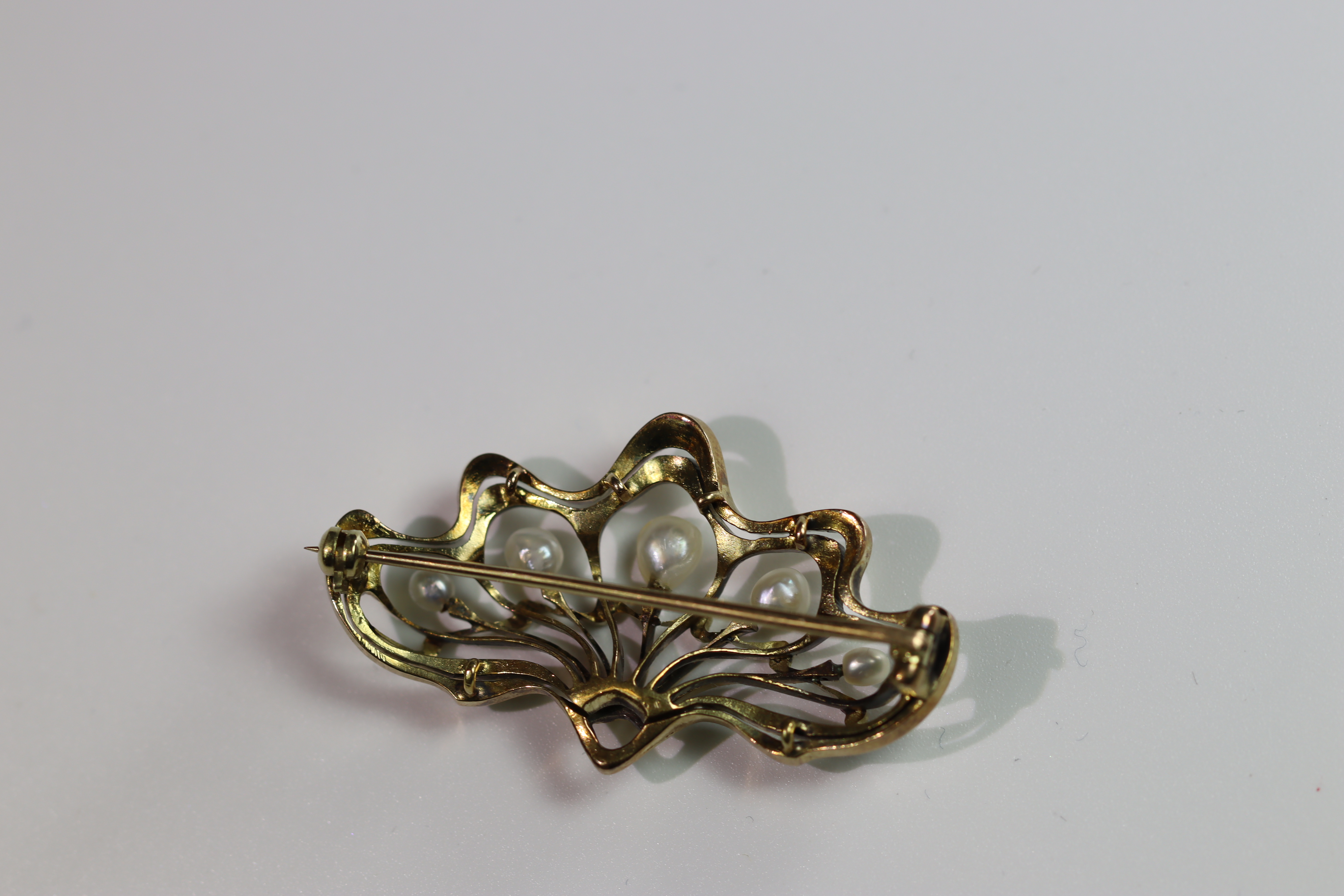 A Natural Pearl and Yellow Gold Brooch, circa 1910 of Art Nouveau style set with five graduated - Image 11 of 11