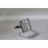 An Unusual Invisibly Set style Princess Cut Diamond Dress Ringmounted in 18 carat white gold,