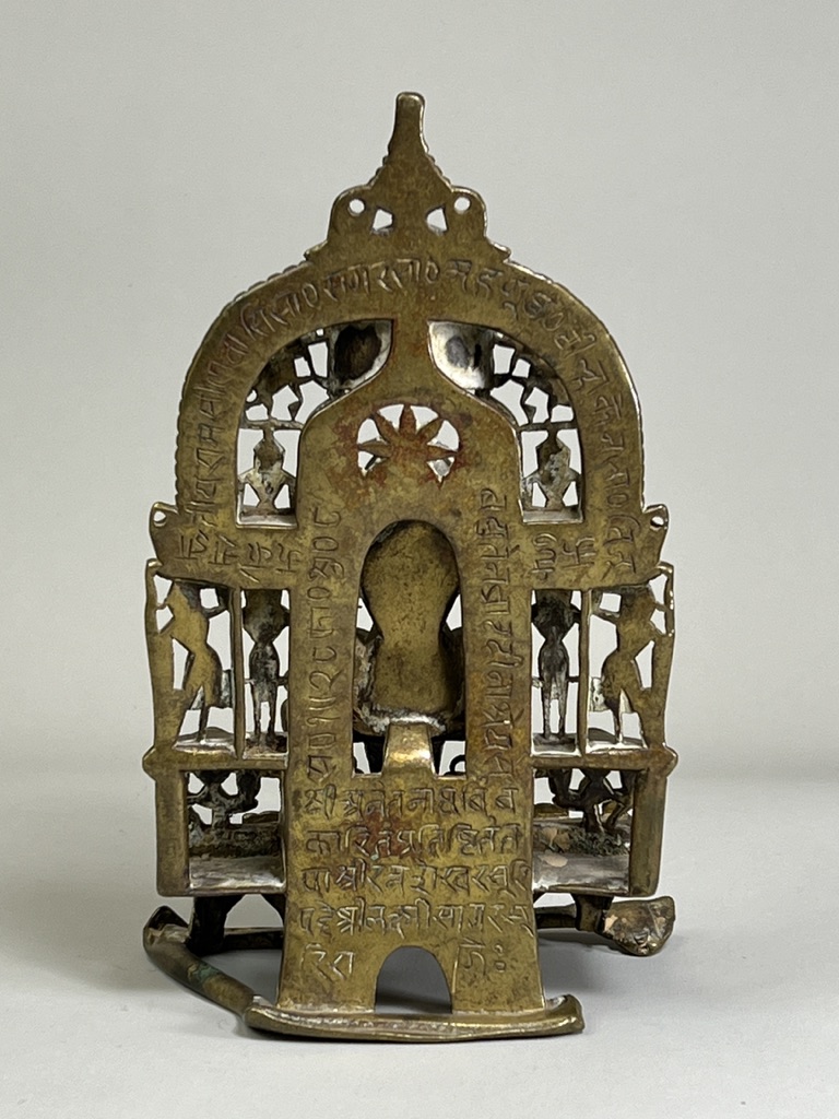 A Bronze Jain shrine. India 15th century.A Jain shrine depicting a Tirthankara with silver inlaid - Image 3 of 18