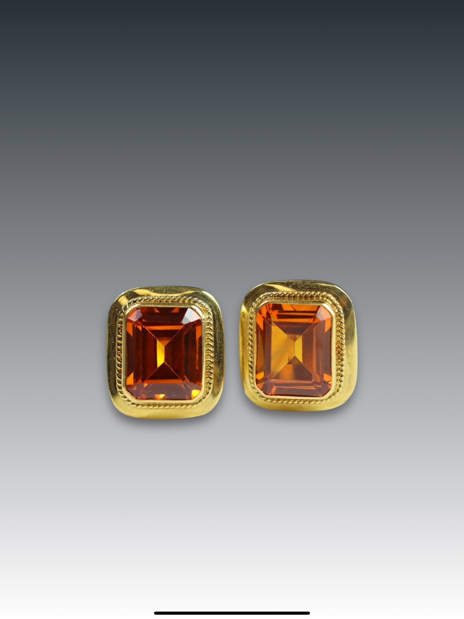 A Pair of man-made Orange Citrine(?) and Yellow Metal (stamped 750) Single Stone Earrings each