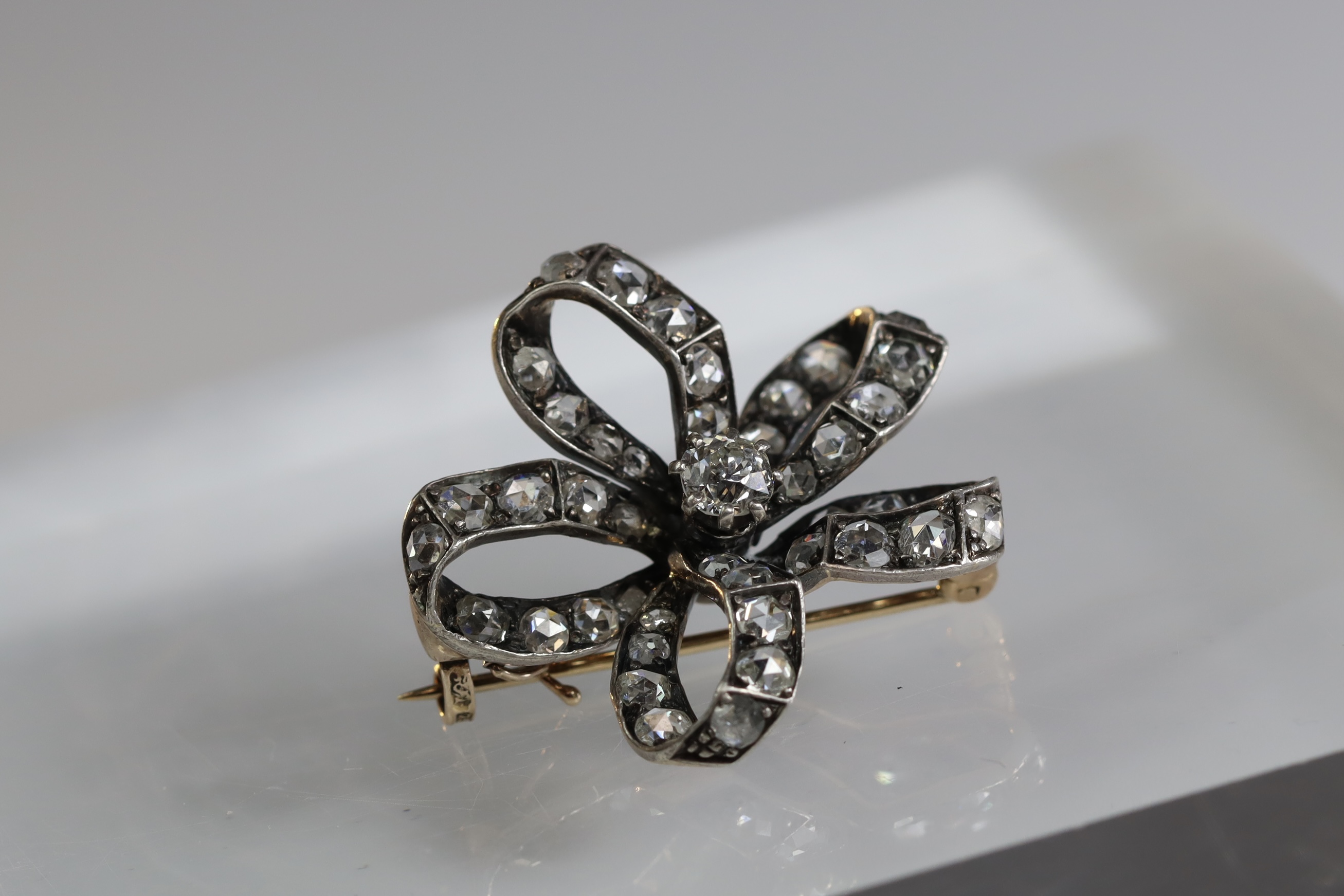 An Antique Diamond and a rose-cut Diamond Stylised Bow Brooch, circa 1890, centrally set with a - Image 4 of 13