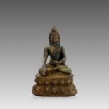 A Bronze Seated Buddha, 19th centuryon a waisted lotus plinth,with dark patination, sealed with lead