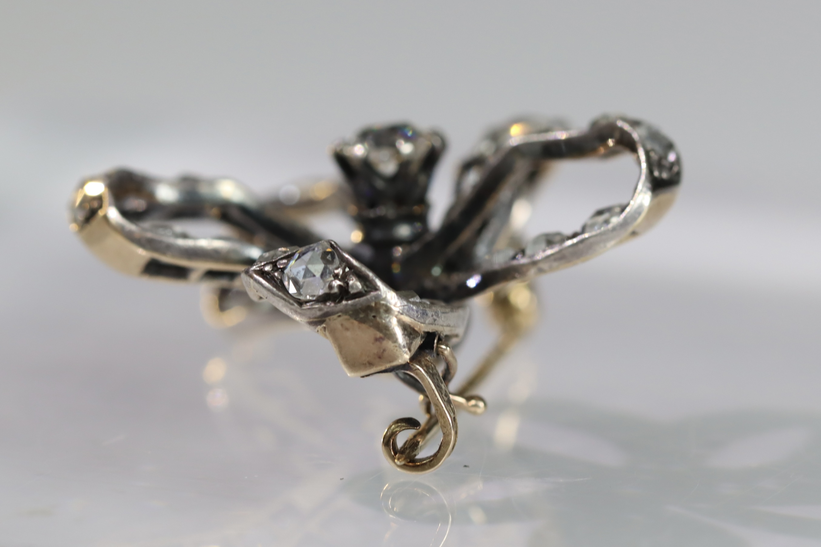 An Antique Diamond and a rose-cut Diamond Stylised Bow Brooch, circa 1890, centrally set with a - Image 10 of 13