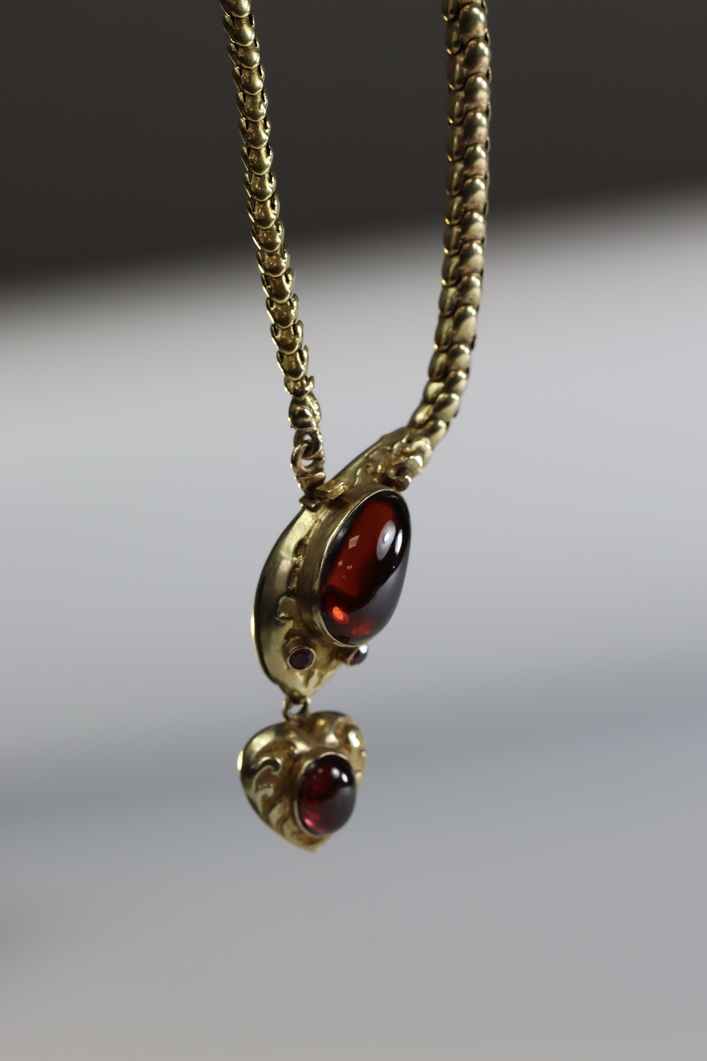 An attractive Antique Cabochon Garnet and Yellow Gold Snake Pendant, circa 1870,the head formed from - Image 9 of 13